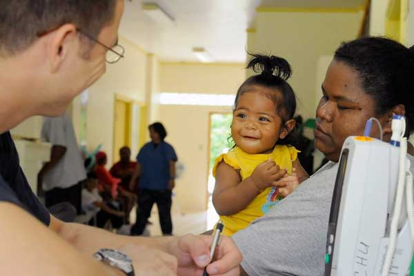 Indigenous mother with her baby at a doctor consultation